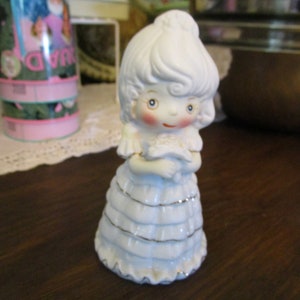 Vintage Porcelain Bride Holding a bouquet of flowers Figurine