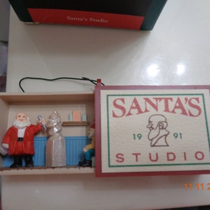 1991 Hallmark Keepsake Ornament Santa&#39;s Studio in orig box with price tag still attached to box