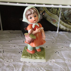 Vintage Porcelain Little Girl carrying a Basket on her arm Figurine