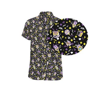 May include: A black button-down shirt with a short sleeve. The shirt has a colourful pattern of stars, hearts, musical notes, and other fun designs in yellow, purple, and white.