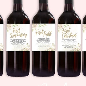 May include: Six wine bottles with labels that say "First Valentine's", "First Anniversary", "First Fight", "First Christmas", "First Big Purchase", and "First Night". The labels have a floral design with gold text.