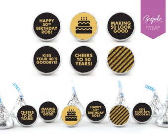 May include: Gold and black round stickers with text such as "Happy 50th Birthday Rob!" and "Kiss Your 40's Goodbye!"  The stickers are designed to be placed on chocolate Kisses candies.