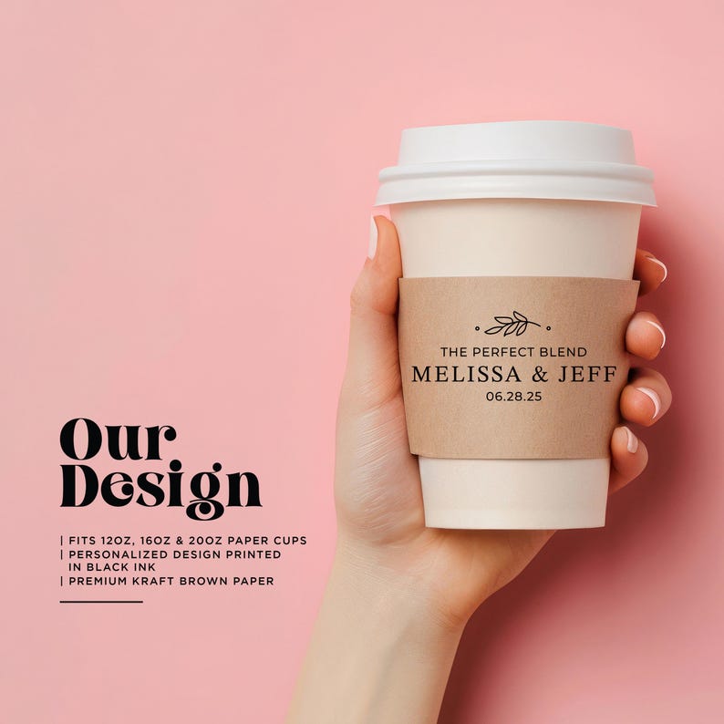May include: A paper coffee cup with a white lid and a brown sleeve held by a hand. The sleeve reads "THE PERFECT BLEND MELISSA & JEFF 06.28.25". The background is a solid pink colour. The text "Our Design" is on the left.