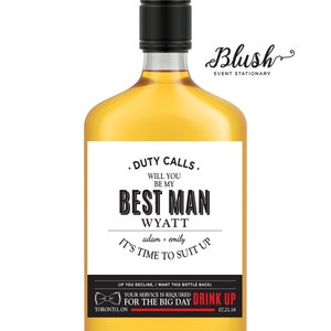 May include: A white liquor bottle label with black text that reads "Duty Calls. Will you be my Best Man Wyatt adam + emily It's time to suit up (If you decline, I want this bottle back) Your service is required for the big day Drink Up Toronto, ON 07.21.18".