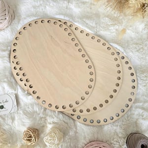 May include: A set of three ceramic nesting bowls in shades of blue, green, and white. The bowls feature a speckled design and varying sizes, perfect for food preparation or serving.