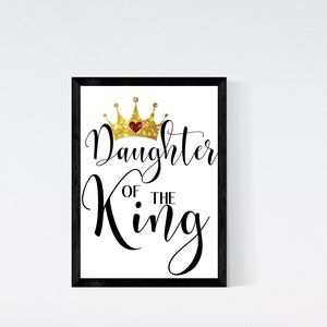 May include: A black framed print with a gold glitter crown and the text "Daughter of the King" in black cursive font.