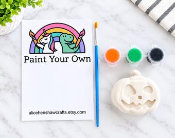 Paint your own ceramic Halloween pumpkin face decoration