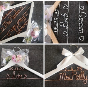 May include: White wooden wedding hangers with custom wire lettering and dates. One hanger reads "Mrs. Rasalan" and "Mrs. Halim" with dates. Another says "Bride" and "Groom" with dates. A third says "I do" with a date, and the last says "Mrs. Reilly" with a date.
