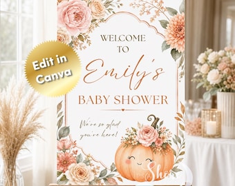 May include: A rectangular welcome sign for a baby shower featuring a white background, a rose gold frame, and floral illustrations of pink and peach flowers. The text reads Welcome to Emily's Baby Shower and We're so glad you're here, with a pumpkin.