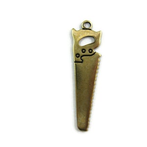 Brass Saw Charm (4 pieces) , Made in the USA