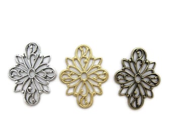 May include: Three ornate metal filigree charms in silver, gold, and bronze. Each charm features a delicate floral design with a circular center.