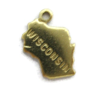 May include: Gold-colored metal charm shaped like the state of Wisconsin with the word "WISCONSIN" inscribed on it.