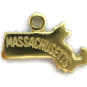 May include: Gold-colored metal charm shaped like the state of Massachusetts with the word "MASSACHUSETTS" inscribed on it.