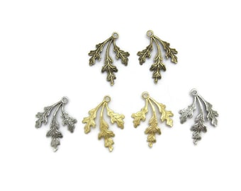 May include: Five metal leaf charms in three different colours: gold, silver, and bronze. Each charm features a delicate, three-branch design with detailed leaf patterns.