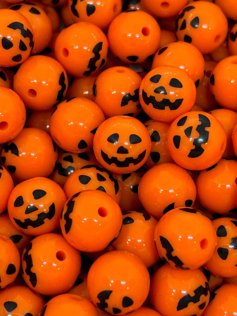 Chunky 12mm Halloween pumpkin beads for jewelry and decorations.