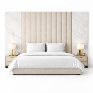 May include: A contemporary bedroom suite with a beige, vertically-panelled headboard, framed by marble-effect panels. The bed has white bedding, two white pillows, and two bedside tables with lamps and decorative items.