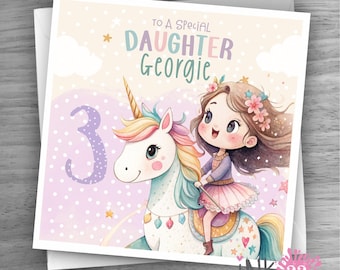 May include: A square greeting card with a watercolor illustration of a girl riding a unicorn. The card reads "To a special daughter Georgie" with the number "3". The unicorn has a rainbow mane and tail. The card has a soft pastel color scheme.