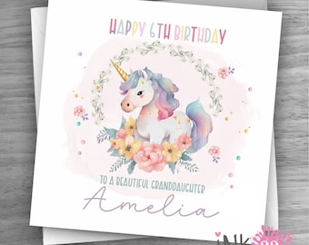 May include: A pink and white birthday card with a unicorn illustration and the text "Happy 6th Birthday to a beautiful granddaughter Amelia".
