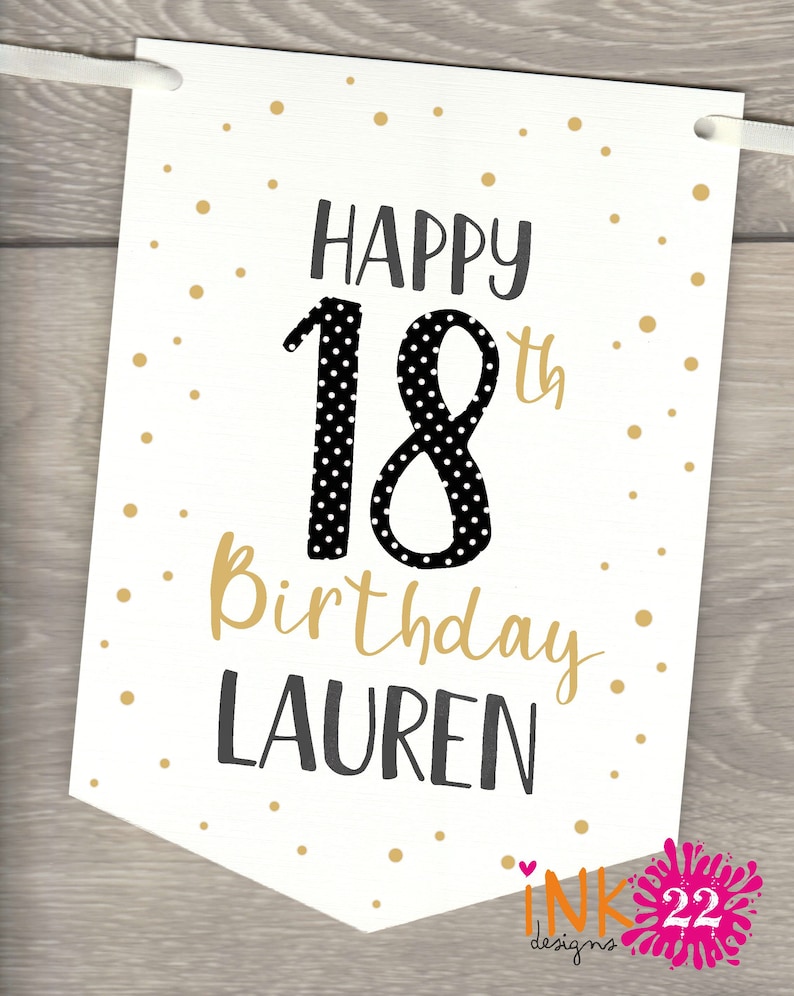 May include: White banner with gold polka dots and black text. The text reads "Happy 18th Birthday Lauren". The number 18 is black with white polka dots.