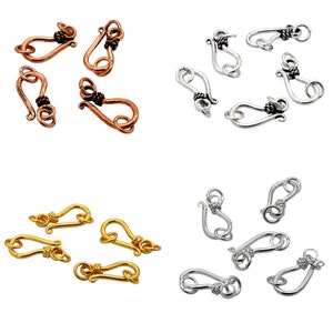 May include: Assortment of 18 gold, silver, and copper lobster clasps. Each clasp has a twisted wire design and a hook closure.