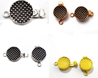 May include: Three pairs of round, decorative clasps for jewelry making. The clasps are available in silver, gold, and rose gold finishes. Each clasp has a textured, diamond-shaped pattern.