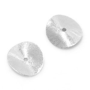 May include: Two silver-toned metal round bead caps with a textured surface and a small hole in the centre.