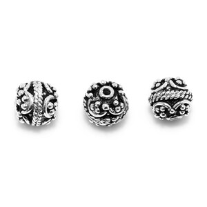 May include: Three silver beads with intricate designs. Each bead has a small hole for stringing.