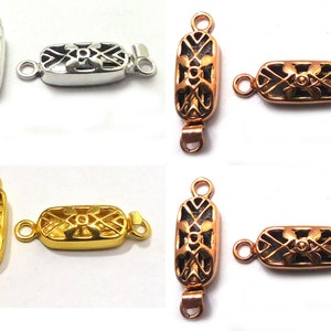 May include: Four pairs of silver, gold, and copper-toned metal clasps with intricate geometric designs. Each clasp has two loops for attaching to a necklace or bracelet.