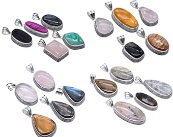 May include: A collection of gemstone pendants in various shapes and colors, including pink, black, green, and yellow. Each pendant has a silver-colored metal frame and a loop for a chain.