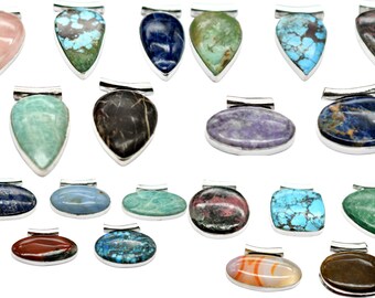 May include: Assortment of 18 gemstone pendants in various shapes and colors, including blue, green, red, brown, and purple. Each pendant is set in silver and features a unique stone.