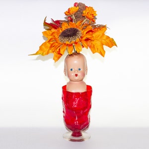 Vintage Doll Head in Red Glass Vase