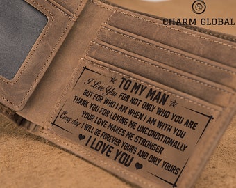 May include: Open, brown leather wallet with multiple card slots and a clear ID window. The wallet features a rectangular patch with the text "TO MY MAN" and a loving message. The brand "CHARM GLOBAL" is visible.