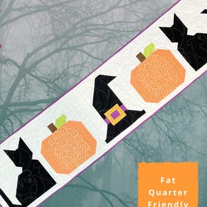 May include: A white table runner with a Halloween theme, featuring black cats, orange pumpkins, and a witch's hat. The runner is 17" x 69" and has a purple border. The text "Midnight Magic Table Runner" is displayed.