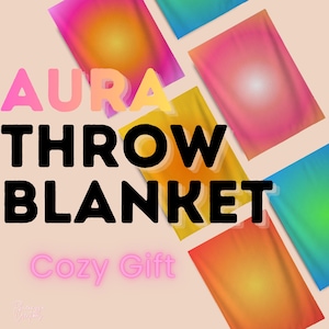 May include: A collection of rectangular throw blankets featuring vibrant gradient aura designs in shades of pink, orange, yellow, blue, and green. The text AURA THROW BLANKET is displayed in large black letters, with the words Cozy Gift in pink below.