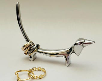 Metallic Dachshund Dog Ring Holder in a smooth silver finish.