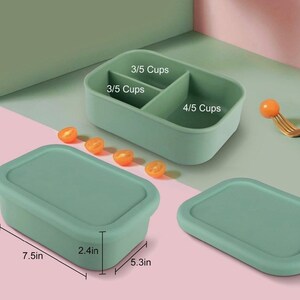 May include: A green silicone food container with three compartments. The compartments are labeled 3/5 cups, 3/5 cups, and 4/5 cups. The container is 7.5 inches long, 5.3 inches wide, and 2.4 inches high.