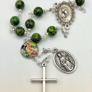 Queen of Heaven Palm Rosary Roman Catholic Marian Devotion Immaculate Heart Mariology Apparitions Shrine Visions Revelations Sacraments Mary