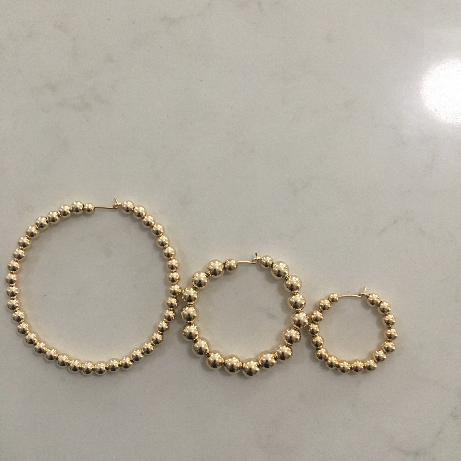 gold hoops with diamond balls