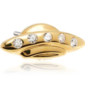 May include: A gold-colored, UFO-shaped earring with five clear, round gemstones. The earring has a polished finish and a small post. The design is a novelty item, likely for those interested in space or science fiction.