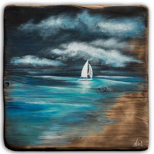 May include: A painting on a piece of wood depicting a sailboat on a blue ocean with white clouds in a dark blue sky.