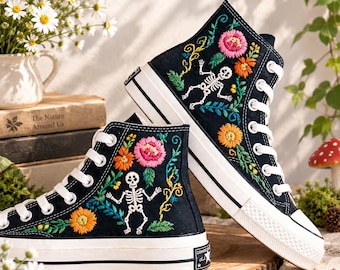 Converse Chuck Taylor 1970 sneakers featuring embroidered skeleton, daisy, and rose motifs:  A high top model with Blooming Bones
