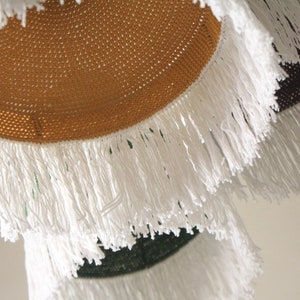 Crochet ceiling light shade styled with minimalist home décor