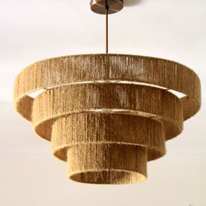 Boho macrame chandelier in natural fibers, ideal for rustic and farmhouse interiors.