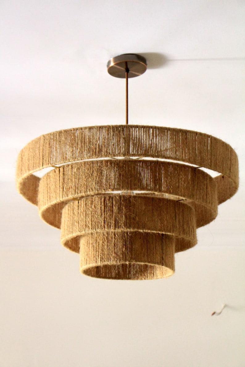 Boho macrame chandelier in natural fibers, ideal for rustic and farmhouse interiors.