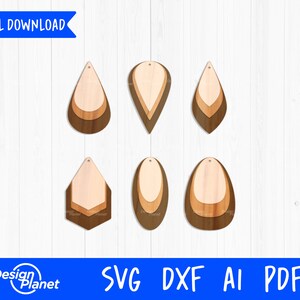 May include: Six different layered wood earring designs. The earrings are in the shape of a teardrop, oval, and hexagon. The wood is a light brown and dark brown color.