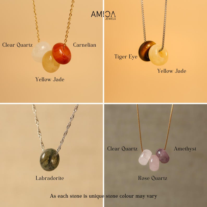 May include: Four necklaces with different gemstone pendants: clear quartz, carnelian, yellow jade, tiger eye, yellow jade, labradorite, clear quartz, rose quartz, and amethyst. Each necklace has a delicate chain. The text "AMIOA JEWELS" is in the top right corner.