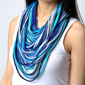 knitted necklace blue strings infinity