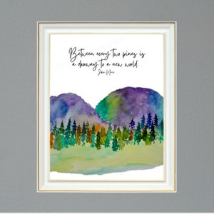May include: A watercolor painting of two purple and green mountains with a forest of pine trees in the foreground. The quote "Between every two pines is a doorway to a new world. John Muir" is written in black cursive at the top of the image.