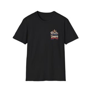 May include: Black t-shirt with a crew neck. The shirt features a small graphic on the upper left chest that reads "Birdie Jones" in a stylized font with a crown and dripping paint effect. The graphic incorporates red, blue, and gold colors.
