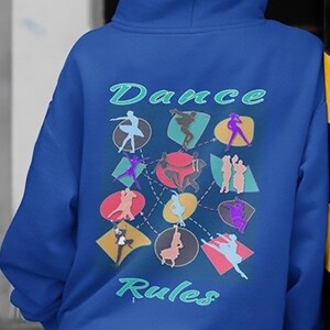 May include: A royal blue hoodie featuring a graphic print of dancers in various poses. The graphic is surrounded by colourful circles and connected by dashed lines. The text "Dance Rules" is printed in a green font below the graphic.